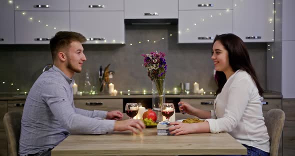 Romantic Dinner at Home Quarantined with Wine Young Couple Valentines Day Guy Makes Girl Surprise