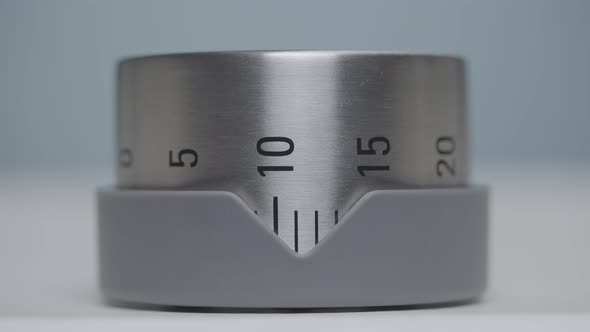 Silver Kitchen Timer with Numbers Rotates and Counts Timelapse