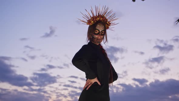 Happy Young Woman in Halloween Costume and Makeup Dances in Nature During Sunset Mystical Footage