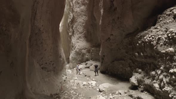 Drone Flying Through Narrow Canyon in Mountains