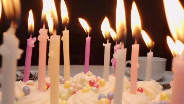 Birthday Cake with Candles on Dinner Table