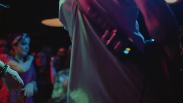 Silhouette of People Dancing at a Rock Band Concert