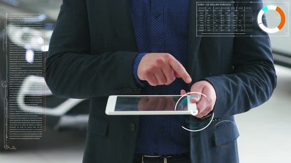 Concept of the Visual Future. A Man Shows on the Tablet a Bitcoin Sign and Futuristic Elements.