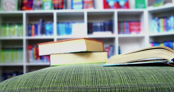 An open book on sofa in library at school