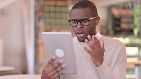 Portrait of Video Call on Tablet By Attractive African Man