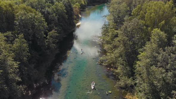 People Sailing on Boats Down the River