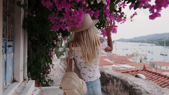 Beautiful Girl Tourist Walking in the Streets of Poros City Greece