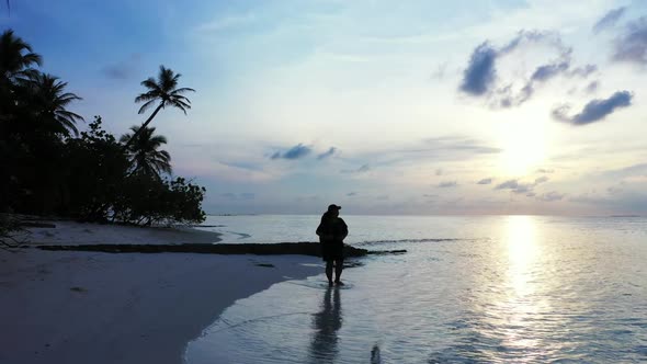 Lady alone posing on relaxing coast beach voyage by transparent lagoon and bright sandy background o