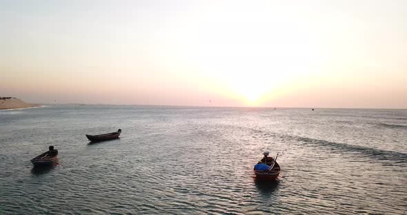 Aerial drone view of boats at sunset