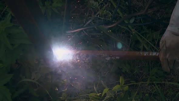 Slow Motion Close View Craftsman Fixes Bottom Part to Fence