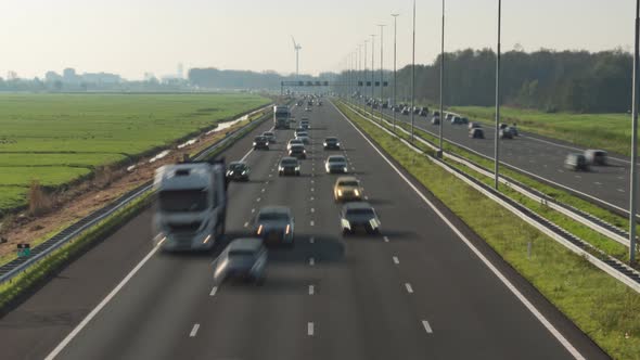 Cars time lapse driving on busy Dutch highway lanes