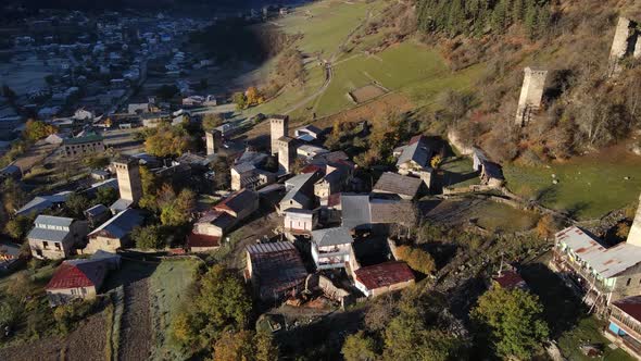 Aerial View of a Small Village in the Mountains with Medieval Towers Georgia