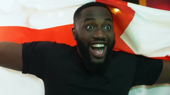 Excited Black Fan Waving English Flag, Rejoicing National Sports Team Victory