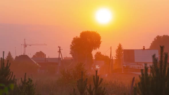 Street on the Outskirts of the Village. Sun Hide Behind the Crown