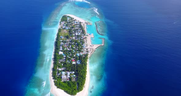 Beautiful aerial copy space shot of a paradise sunny white sand beach and blue water background 