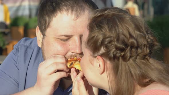 Fat Boyfriend and Girlfriend Eating Pizza Outdoors Romantic Date, Junk Food Diet