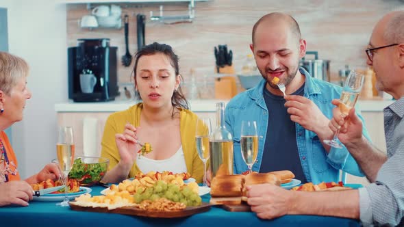 Family Interacting While Having a Meal