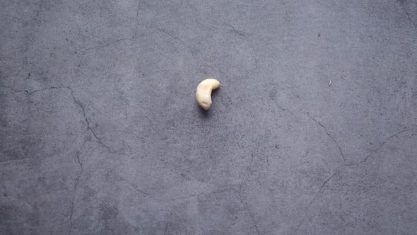 Slow Motion of Cashew Nut on Falls on Black