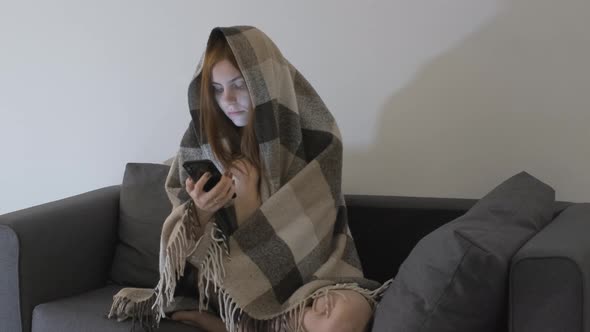 Beautiful Redhaired Woman is Bored at Home During Quarantine