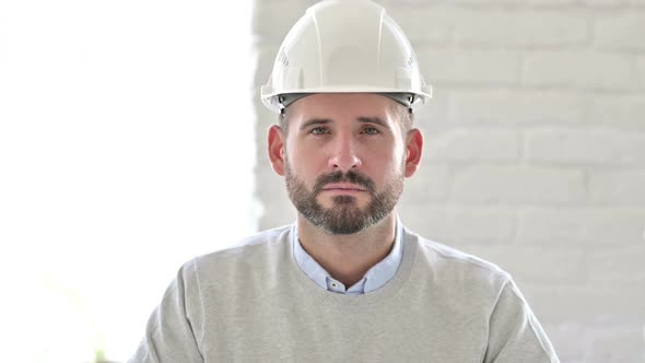 Portrait of Serious Young Engineer Looking at the Camera