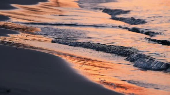 Real time shot of beach sunset with waves