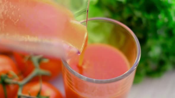 Tomato Juice with Sprig of Tomatoes on Background