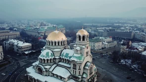 Fly to top of Aleksandar Nevski in Sofia on cloudy day