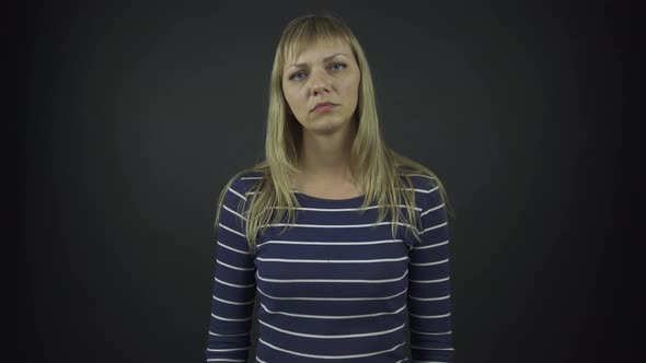 Blonde Actress Plays Role of Serious Lady Standing on Stage