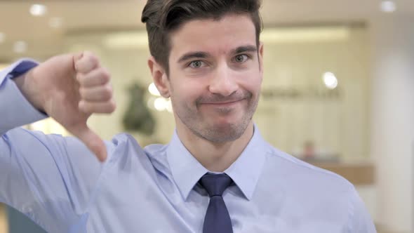 Thumbs Down By Businessman