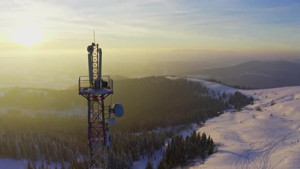 Flying Over Radio Communications Tower Mountain Snow Covered Winter Landscape