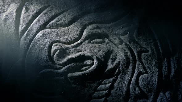 Shaft Of Light Reveals Old Dragon Stone Carving