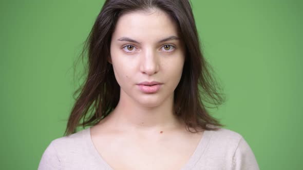 Young Beautiful Woman Covering Ears As Three Wise Monkeys Concept