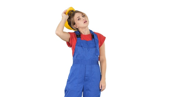 End of working day Construction worker woman taking hardhat