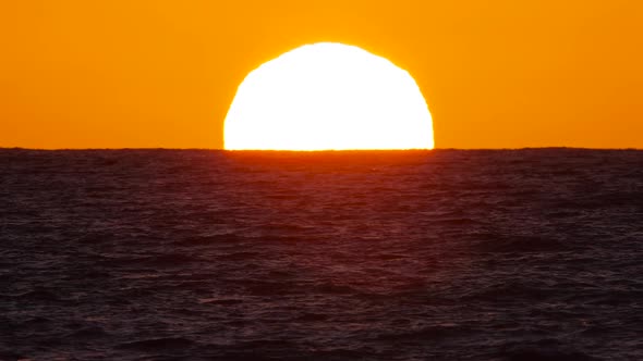 Sun Over the Sea The Concept of Sunset or Dawn Sunlight Shines Through the Ocean Waves