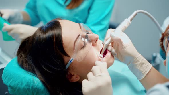 Woman patient with opened mouth at stomatology clinic