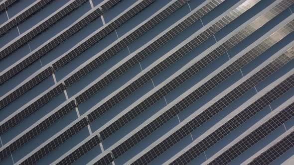 Aerial Perspective Solar Panel Farm Green Energy at Winter Snow Sunny Day Drone Shot of Ecology