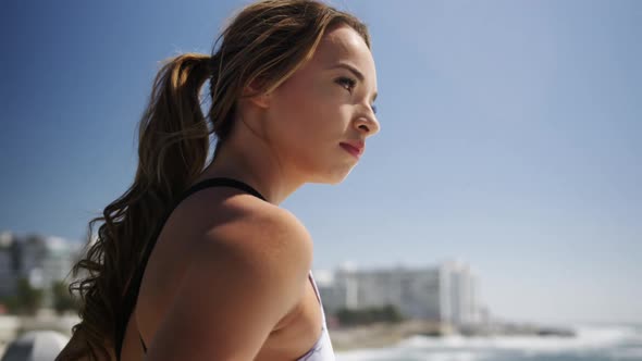 Beautiful woman standing on the beach 4k