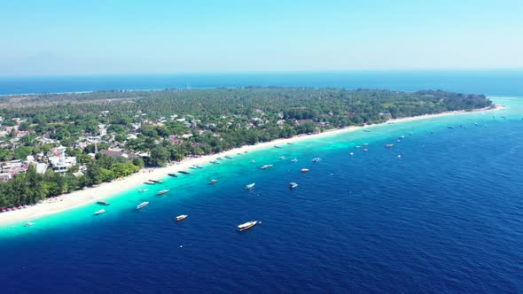 Aerial top down nature of beautiful seashore beach adventure by shallow ocean with white sand backgr