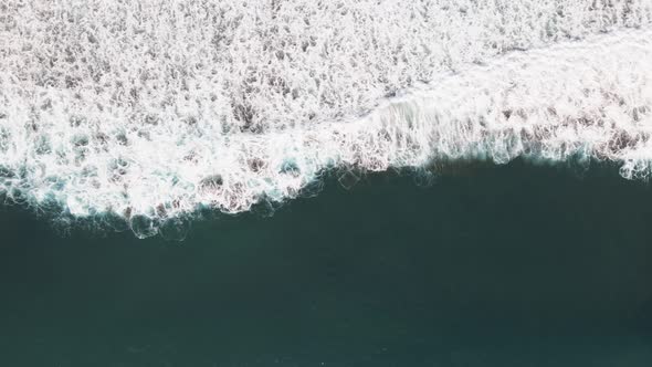Aerial View Of waves in Dominical Beach in Costa Rica, Panning Wide Shot