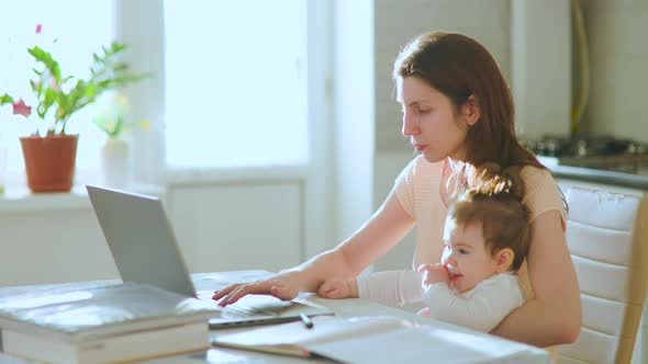 A Multitasking Mom With Little Child Working Remote is Stressed Out