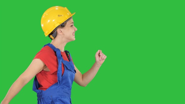 Female worker in hardhat walking happy Construction