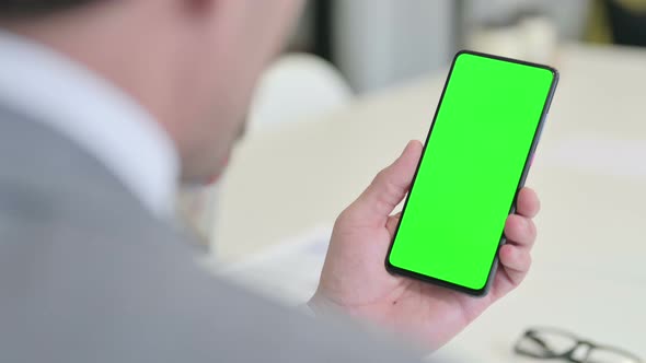 Businessman Using Smartphone with Green Chroma Screen