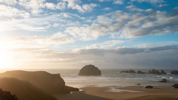 Time Lapse of clouds at sunset over Face Rock, a famous tourist destination in Bandon at the Oregon