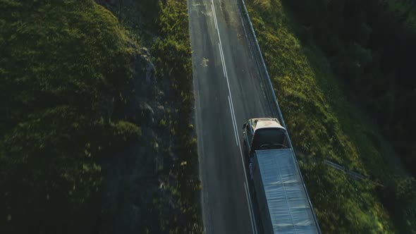 Aerial View of Over Twoline Road with Cargo Truck Lorry Moving to Logistics Center Driving Across