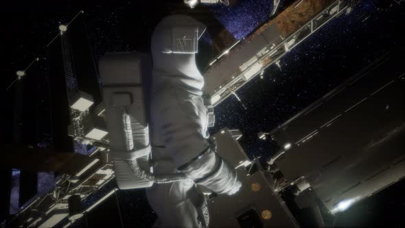 Astronaut Outside the International Space Station on a Spacewalk alt