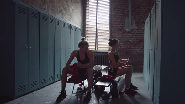 Two Female Boxers before Training in Lock Room