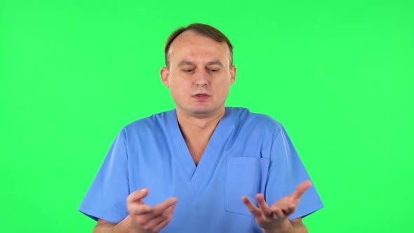 Medical Man Tells Information By Gesturing with His Hands, Gives Recommendations. Green Screen