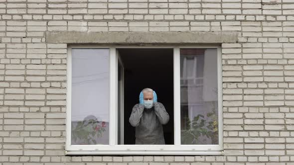 Old Man Grandfather Stay at Window Isolated at Home on Quarantine. Coronavirus alt