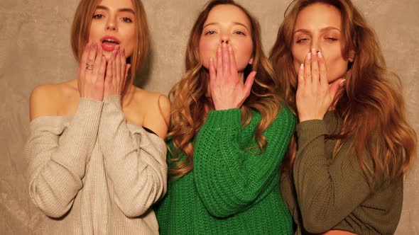 Three beautiful girls wearing summer hipster clothes