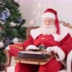 Santa Claus writing on an old typewriter. Concept of letters, writing down an idea or names. - VideoHive Item for Sale